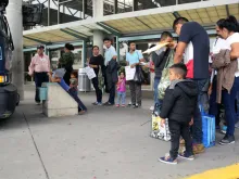April 17, 2019: Central American migrants seeking asylum line up at the bus station in McAllen, Texas to go stay with their sponsors